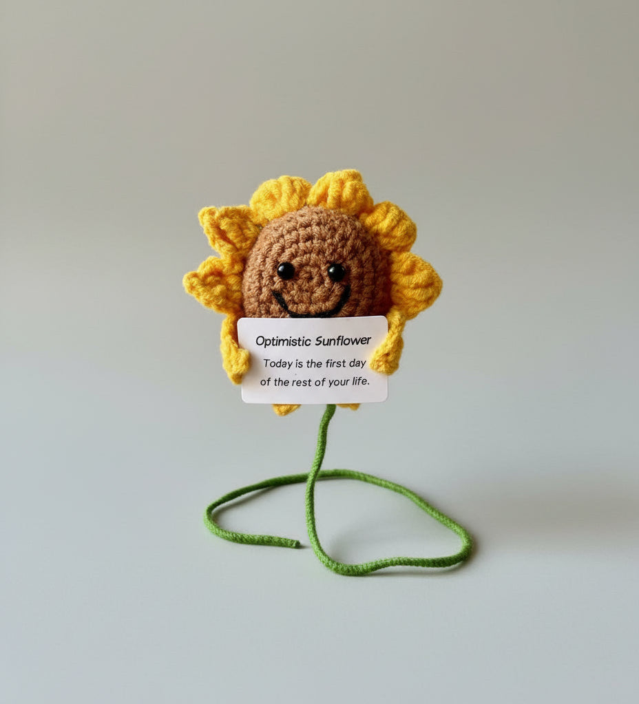 Gehäkelte optimistische Sonnenblume auf einem Draht im Studio