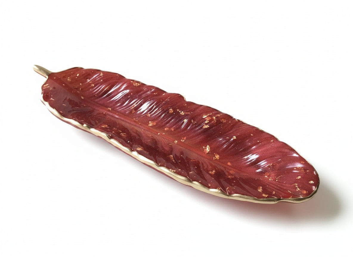 Schmuckablage aus Epoxidharz in Federform - elegante Ringschale
